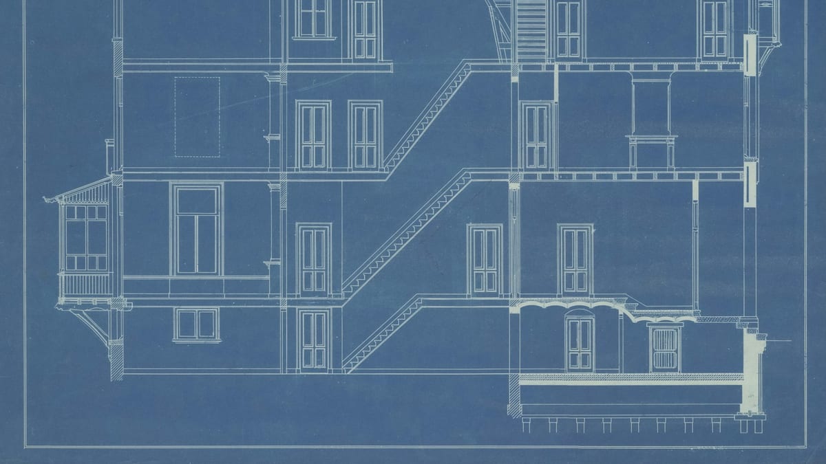 A blue architectural blueprint showing a cross-section through a multi-storey building with staircases.